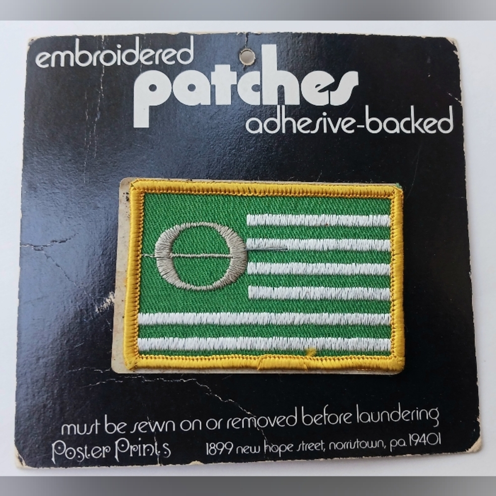 New In Package Green Ecology Patch Yellow Stitch Trim Silver Center Collectible